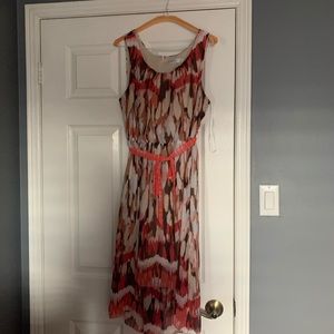 RICKI’S Patterned dress with sash.